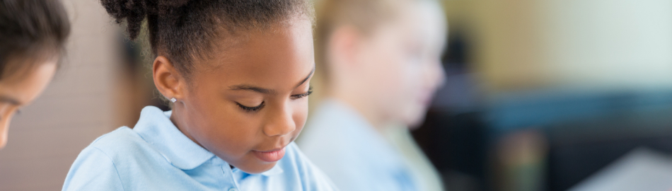 Elementary school young girl doing school work
